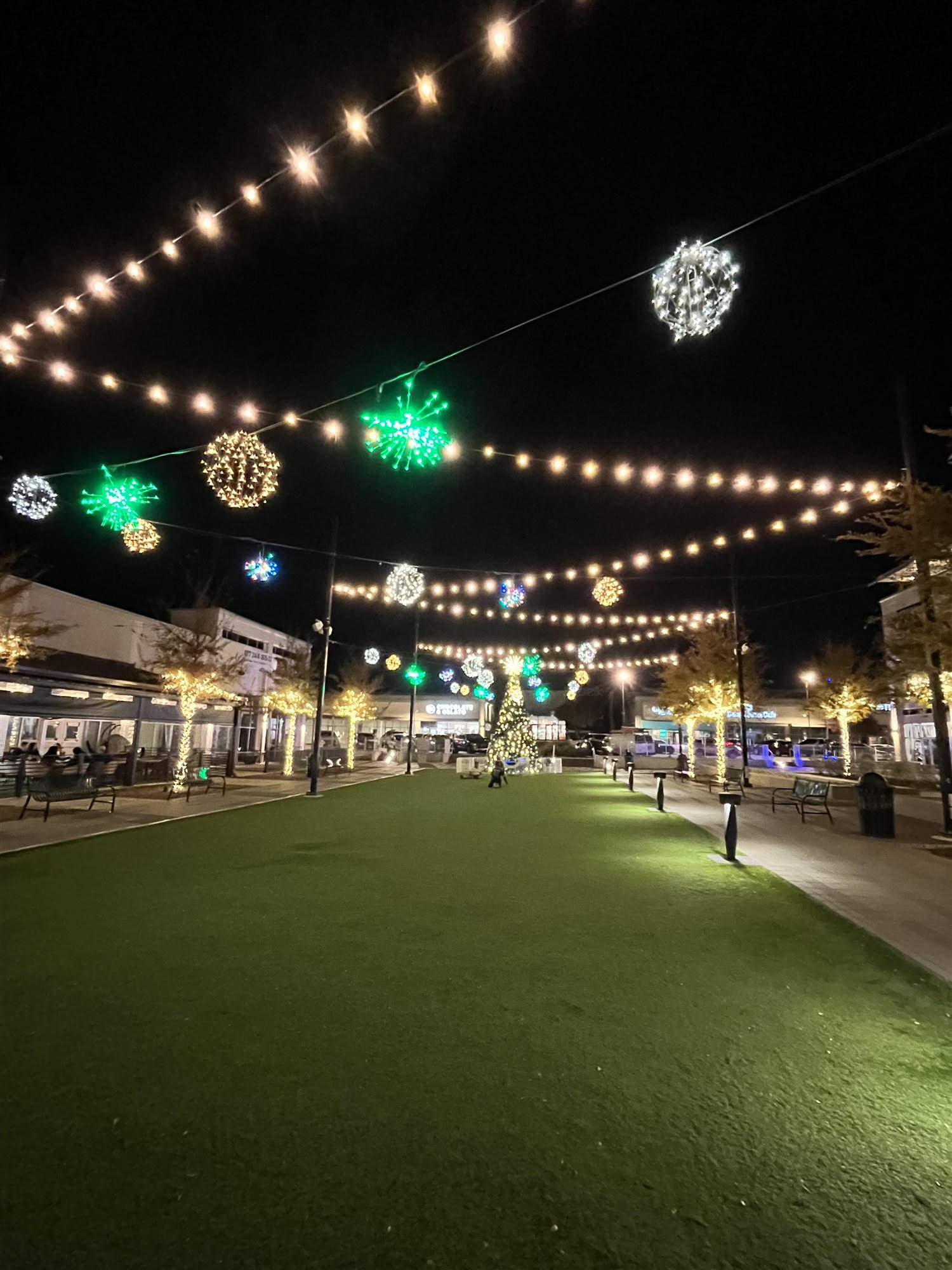 Outdoor plaza string lighting at night